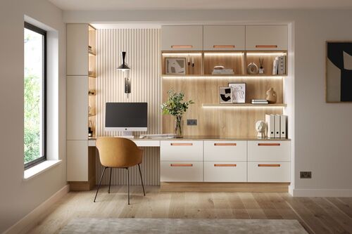 A study nook with a computer, a chair and an open shelving