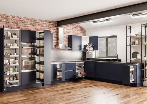 Modern kitchen with exposed brick and full-height pantry storage cabinets