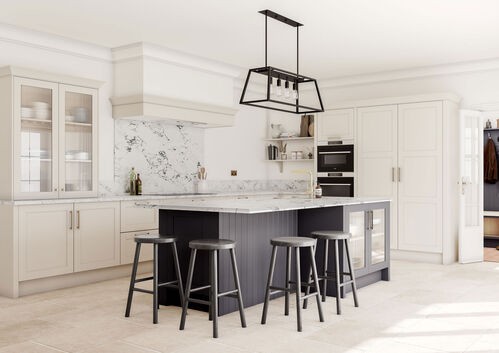 White kitchen with gray island and black pendant lighting