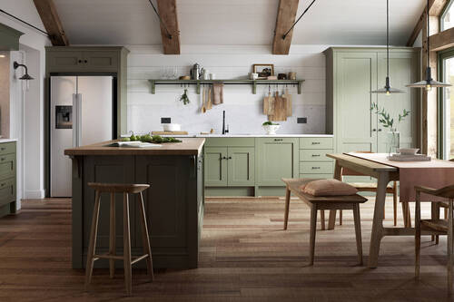 Farmhouse kitchen with sage green cabinets and wooden island