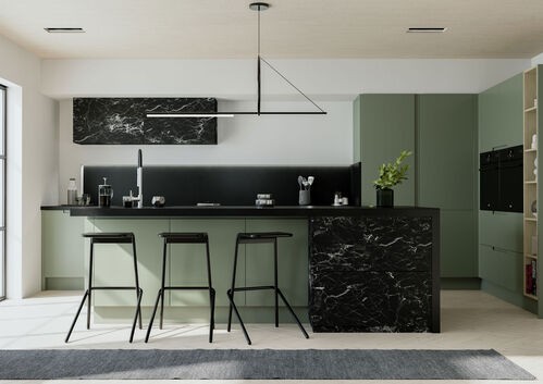 minimalist kitchen with sage green cabinets, black marble island, and three bar stools