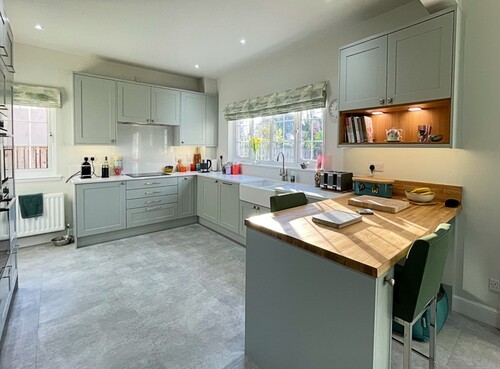 Built-in white wardrobe and storage solutions in modern bedroom
