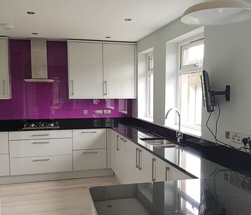 Built-in white wardrobe and storage solutions in modern bedroom