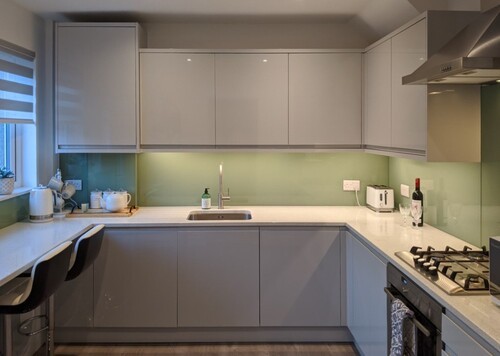 Built-in white wardrobe and storage solutions in modern bedroom