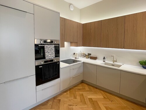 Two-tone kitchen with white uppers and taupe lower cabinets