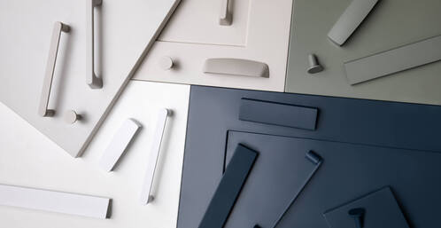 Close-up of brushed metal kitchen handles enhancing contemporary kitchen design