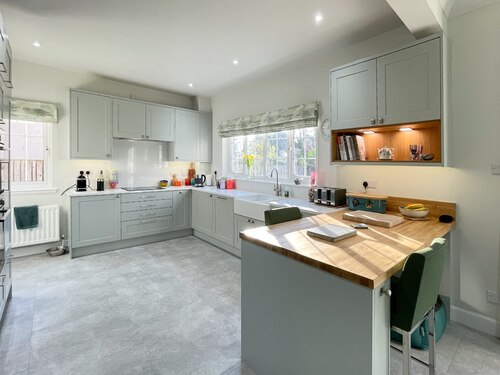 open plan grey shaker kitchen 