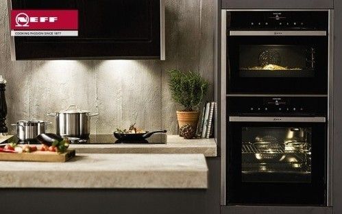 NEFF kitchen appliances in a stone wall kitchen