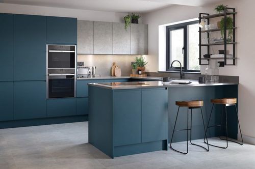Image of a modern blue and grey kitchen design with concrete worktops and cupboards.