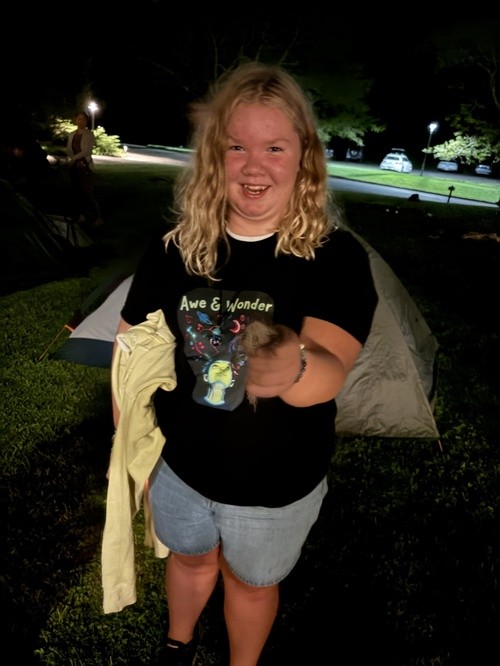 A young person enjoying an evening outdoors