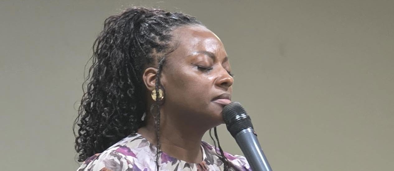 BHN Charlotte congregation worshiping with hands raised