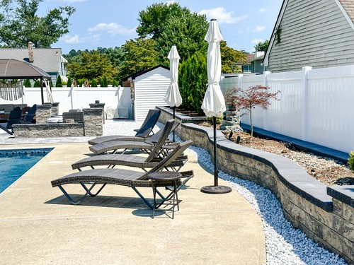 Seating walls and support wall with garden bed planting in Passaic County NJ