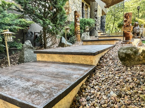 Wood look stamped concrete landing steps in a Montville, NJ garden