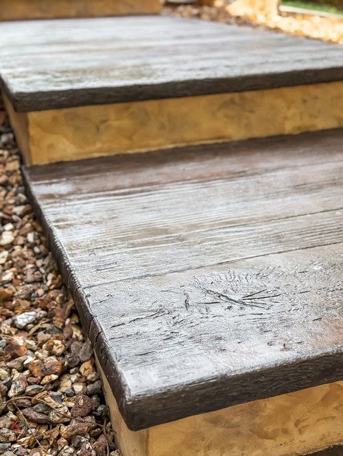 Rough sawn timber edge on stamped concrete steps in Montville, NJ