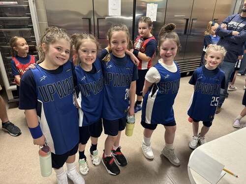 A man an woman volunteering as coaches for upward sports