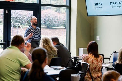 People connecting and growing in faith together during a small group at home.