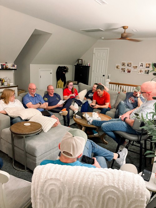 People connecting and growing in faith together during a small group at home.