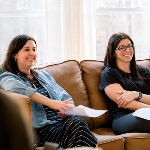 People connecting and growing in faith together during a small group at home.