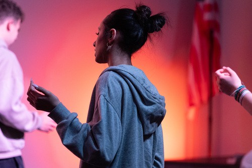student praying at Victory Youth
