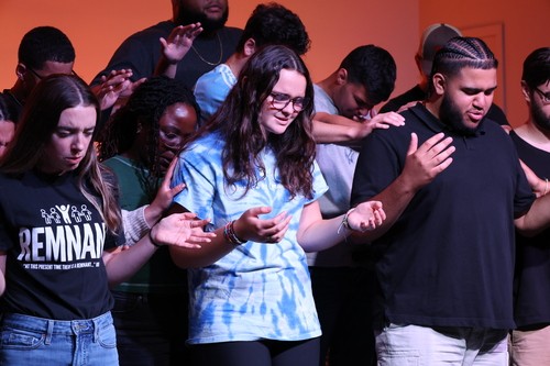 students praying at Victory Youth