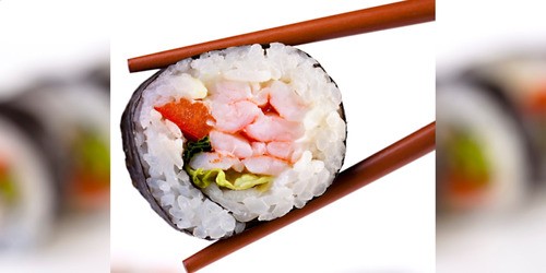 chopsticks holding sushi