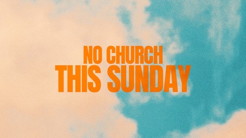 Champion Church congregation during a church sermon with two screens displaying church lesson.