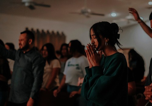 At Grace Plano Church, a young woman participates in worship, embodying a godly generation of youth.