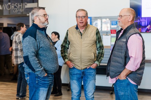 Picture of people talking in community at Trinity Church