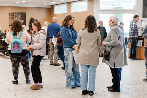 Picture of people talking in community at Trinity Church