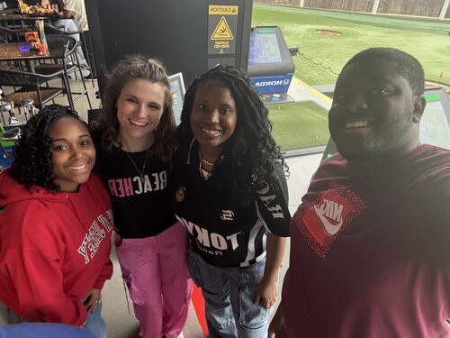 Multicultural Young professionals at TopGolf