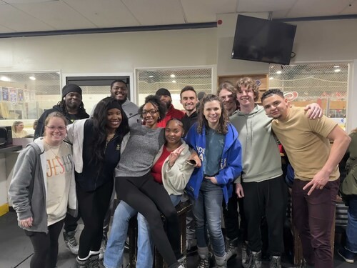 Multicultural young professionals ice skating