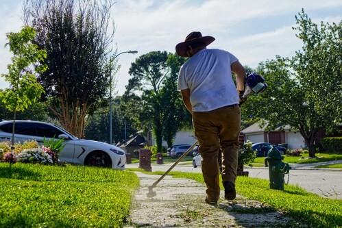 Volunteers doing yard cleanup and landscaping