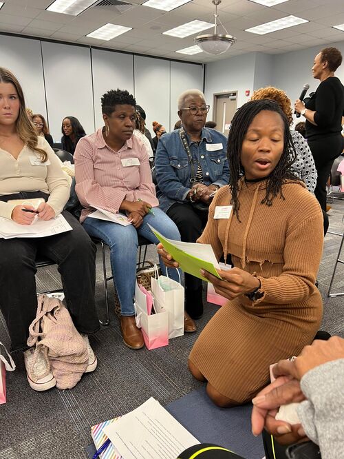 Lucretia leading her team during Dr. Deb's presentation