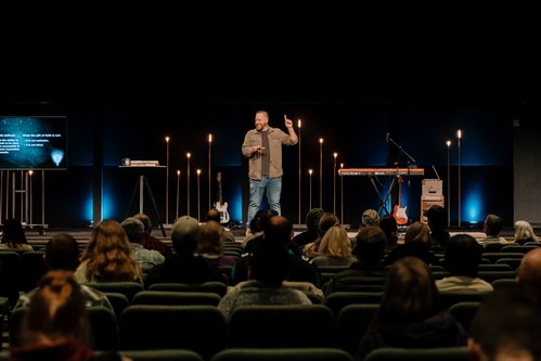 Pastor speaking to the congregation during a Calvary Oceanside service