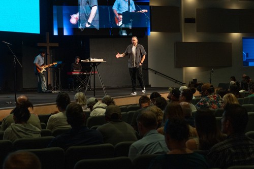 Pastor speaking to the congregation during a Calvary Oceanside service