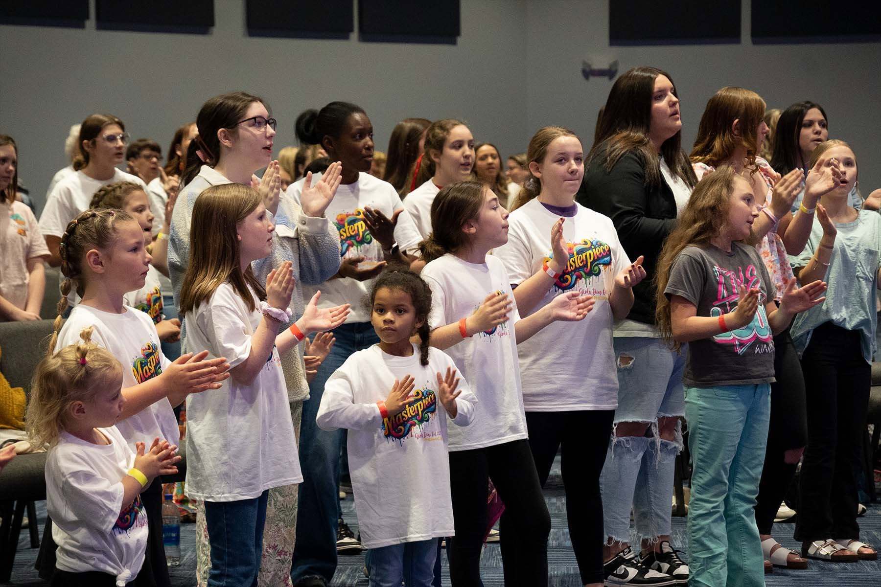 Girls worshiping together