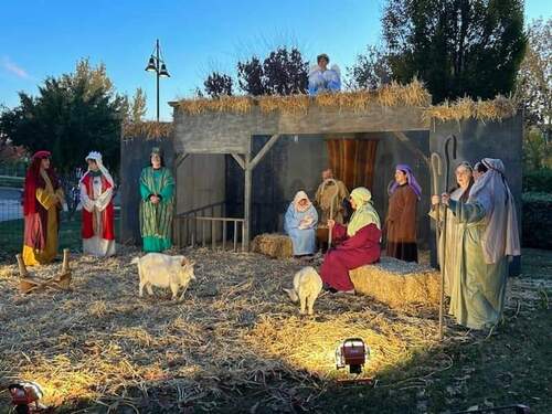 a photo of the live nativity with Mary, Joseph, Jesus, Angel, Wise Ones, and the traveling Magi