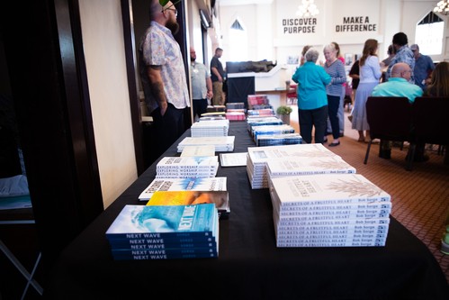 Member of Liberty Church manning the books table for a guest speaker.