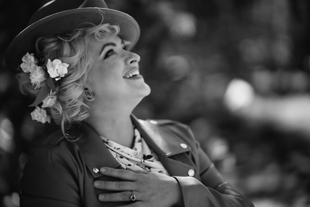 Prudence O'Haire laughing, in black and white