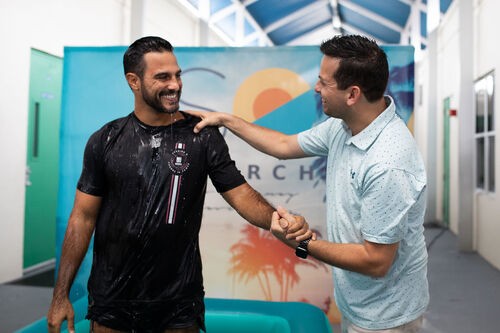 volunteers posing for a fun photo before serving
