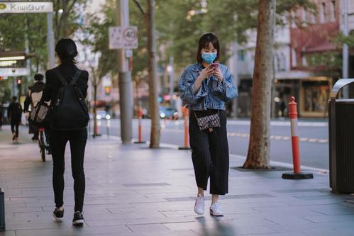 Girl In Downtown Vancouver Wearing COVID-19 Face Mask.