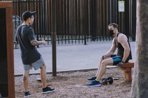 Two Men Talking Outside, Wearing Face Masks