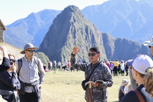 Our guide, Jacob,  explaining the history of Macchu Picchu, Peru