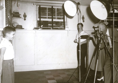Vintage photo of young boy posing for camera.