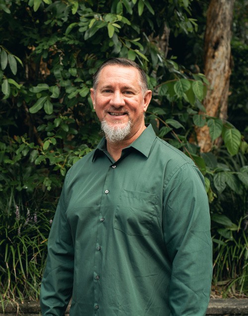 UHBC Pastor Rodney Cripps standing outside.