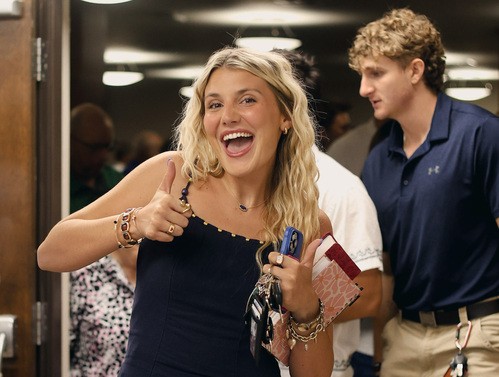 UHBC college student smiling and giving a thumbs up at University Heights Baptist Church in Stillwater, OK