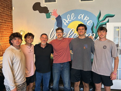 UHBC University Ministry students and pastor posing together at a community service event in Stillwater, Oklahoma