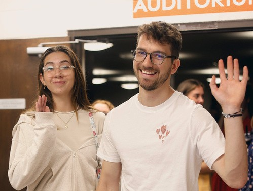 UHBC college students waving and smiling at a University Ministry event in Stillwater, Oklahoma