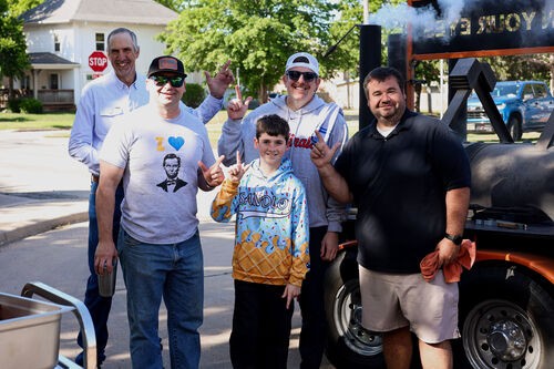 UHBC members gathered outdoors on a trailer enjoying a fall activity together in Stillwater, Oklahoma
