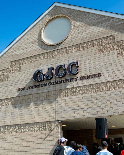 Photo of Gus Johnson Community Center sign on building